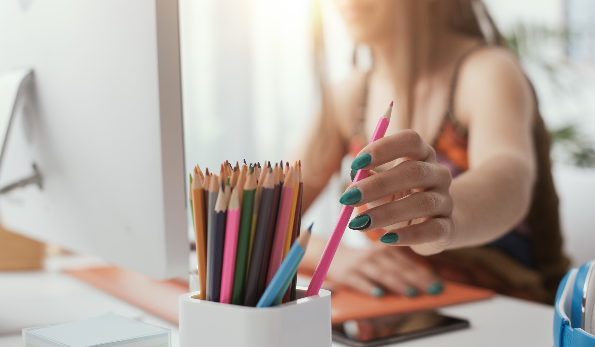 Designer taking a colored pencil