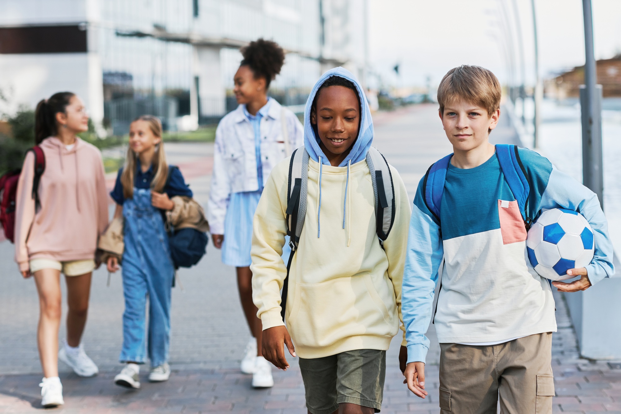 Group of intercultural adolescent secondary school learners going home