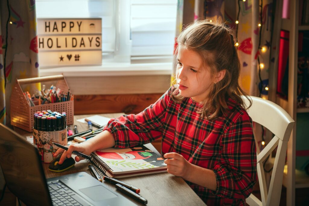 Teen girl having online drawing lesson.