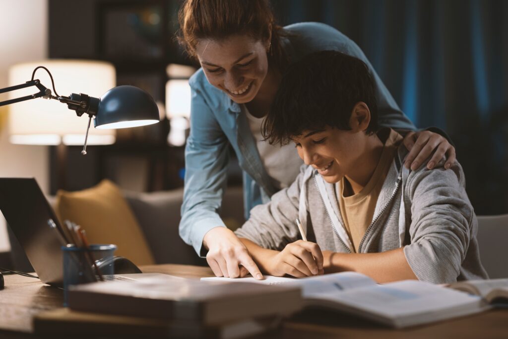 Tutor helping a student with his homework