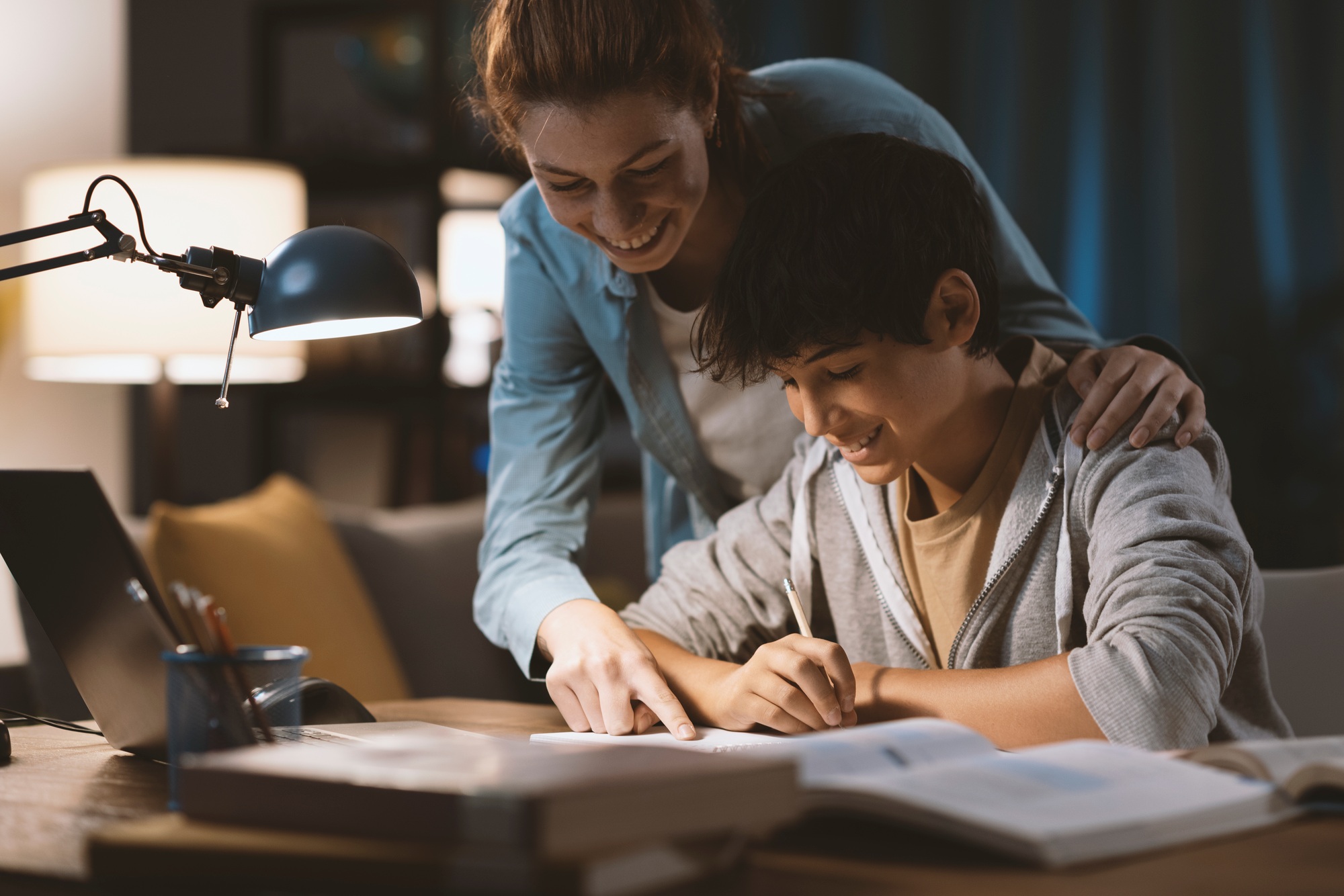 Tutor helping a student with his homework